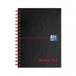 The photo of the Black n Red Books Black n Red Wirebound Hardback Ruled Notebook A6 (Pack of 5) shows five sleek, black notebooks with a red spine and secure wire binding. Each notebook has ruled pages, making them perfect for writing or taking notes.