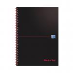 The photograph features a group of black and red books, titled Black n Red, sitting next to a stack of wirebound notebooks. The notebooks have 100 pages each and are in A4 size. The books and notebooks are neatly organized, with a sleek and professional design.