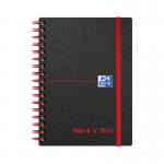 The image shows a pack of five Black n Red wirebound notebooks, each with a bright red polypropylene cover and black pages. The compact A6 size and 140 ruled pages make them perfect for writing on the go.