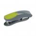 The photograph shows a Q-Connect Mini Plastic Stapler in grey and green. It has a capacity of 12 sheets of 80gsm paper. The sleek design and color combination make it stand out on any desk. Its compact size makes it perfect for on-the-go stapling tasks.
