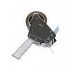The image shows a transparent Q-Connect packing tape dispenser with a black handle and metal cutting blade. The dispenser is sitting atop a matching Q-Connect packing tape roll. The packaging features the Q-Connect logo and product name in white font on a blue background.