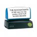 The photograph captures a Q-Connect custom pre-inked stamp, voucher and stamps in vibrant colors. The stamp measures 57x20mm and is surrounded by sleek packaging with the Q-Connect logo.