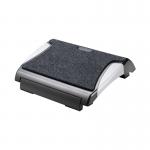 The picture shows a black and silver Q-Connect footrest with a removable carpet, designed to provide support and comfort. This versatile product helps improve posture while sitting at a desk or workstation.