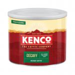 The picture shows a 500g jar of Kenco Decaf Coffee, labeled as Kenco Decaffeinated Freeze Dried Instant Coffee. The coffee is in a powdered form and appears to be rich and dark in color. A red label with the Kenco logo is prominently displayed on the jar. The background is a clean white, allowing the coffee to be the main focus of the image.