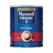 A 750g tin of Maxwell House Coffee Powder, featuring the iconic red and gold packaging, sits prominently on a kitchen countertop. The tin is open, revealing the rich, dark brown coffee grounds inside. The aroma of freshly brewed coffee fills the air.