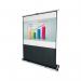 The photo shows a rectangular Nobo projector screen. It is portable and measures 1620x1220mm. The screen is white and has a black border around the edges. In the background, there is a meeting room with chairs and a table. The screen is set up on a stand and has a clear and crisp projection on it.