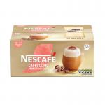 The photo depicts a pack of 50 Nescafe Gold cappuccino unsweetened instant coffee sachets from Nestle. The sachets are neatly arranged in rows within the pack, showcasing the brand logo and product name prominently. The rich brown color of the sachets is complemented by the bold red packaging, making it an eye-catching display.