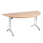 The photo shows a sleek, modern folding table from Nautilus Designs. With a semi-circular shape and a beech top, it seamlessly combines both style and functionality. The chrome frame adds a touch of elegance, making it a versatile addition to any space.