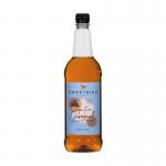 This photo shows a 1 litre bottle of Sweetbird Sugar Free Caramel Coffee Syrup. The plastic bottle has a vibrant label with the brand logo and product name. The syrup itself is a rich, decadent caramel color.
