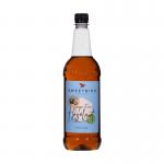 The photo shows a 1-litre plastic bottle of Sweetbird Sugar Free Hazelnut Coffee Syrup, from their Sweetbird Coffee Syrups line. The label is clearly visible and features the brand logo and product name. The bottle is filled with a rich, amber-colored liquid, ready to enhance any coffee drink.
