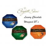 A mouth-watering photograph featuring Colian Chocolate Elizabeth Shaw Milk Chocolate Orange Crisp. The 26 individually wrapped chocolates are nestled in a vibrant orange box, offering an enticing glimpse into the creamy, indulgent treat inside. Perfect for any chocolate lovers collection.