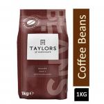 In the photograph, you can see a pack of Bettys & Taylors Decaf Coffee, featuring 1kg of decaffeinated coffee beans from Taylors of Harrogate. The pack contains 2 units and is labeled as NWT6116P. The coffee beans are in their natural brown color, with a strong aroma emanating from them. The packaging is simple and elegant, with the brand name and product information clearly stated.