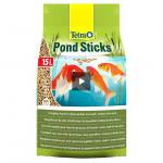 The image shows a blue bucket labeled Spectrum Pet Supplies Tetra Pond Sticks with 15 Litre NWT6321 written on a white label. The bucket is filled with round, brown fish food sticks, with some fish swimming in a pond in the background.