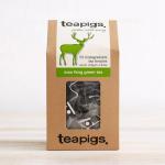 The image shows an assortment of 50 tea temples from Tata Consumer Products Fruit and Herbal Tea line, specifically Teapigs Mao Feng Green Whole Leaf Tea. The packaging is a sleek black box with the brands logo prominently displayed, and the tea temples themselves are neatly arranged in rows. The tea is a vibrant green color and the leaves appear to be of high quality. A sense of elegance and refinement emanates from the overall presentation.