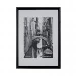 The photo features a stunning Hampton Frames Wooden Frame in A3 size, with a sleek black finish. It is perfect for showcasing your favorite memories or artwork, with high-quality craftsmanship and a timeless design. The frame has a classic and elegant feel, making it a versatile addition to any home decor.