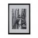 The photo features a stunning Hampton Frames Wooden Frame in A3 size, with a sleek black finish. It is perfect for showcasing your favorite memories or artwork, with high-quality craftsmanship and a timeless design. The frame has a classic and elegant feel, making it a versatile addition to any home decor.