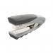This photograph captures a sleek silver and black Rexel Centor half strip stapler, featuring the brands logo and product name clearly visible. The stapler is shown in a closed position, perfect for securely binding papers together. The modern design is sure to add a touch of professionalism to any workspace.