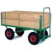 A photo of Slingsby platform trucks shows heavy-duty turntable trucks with wooden platforms. They measure at L x W - 1600 x 711 and have pneumatic tyres, apt for sturdy and smooth movement.