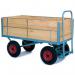 This picture features a pair of strong and durable slingsby platform trucks, with a turntable design and wooden platforms measuring 1600 x 711. The trucks also feature rubber tyres for easy maneuverability.