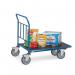 This picture showcases the Slingsby Baskets and Trolleys Fetra cash & carry trolleys. The trolleys are made of sturdy metal and have four wheels, perfect for carrying heavy items. The baskets on the trolleys have a mesh design, allowing for easy visibility and airflow. The trolleys are lined up neatly, with different sizes and shapes available. The background shows a warehouse setting, suggesting these trolleys are ideal for commercial use.