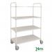 This photo showcases sleek, industrial-style slingsby shelved trolleys with tall, reversible steel tray shelves. The shiny silver material and sturdy construction make these trolleys perfect for transporting heavy loads in warehouses, factories, and other commercial settings.