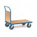 The picture shows a sturdy, metal platform truck with a single panel end. The truck is dark in color and has a sleek design. The platform is raised slightly off the ground and has a curved handle for pushing. The truck is empty, ready to be loaded with goods.
