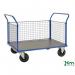 The photo features a slingsby Platform Truck Konga heavy duty platform truck with mesh sides and braked wheels. The sturdy design and mesh sides provide secure transportation for heavy loads while the brakes ensure safe and controlled movement.