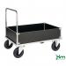 In the photograph, there are several Slingsby Warehouse Trolleys Konga heavy duty zinc plated box trucks, specifically the 412875 model. The trolleys are large and sturdy, with a zinc plated finish that gives them a sleek appearance. Each trolley has four wheels and a large rectangular box attached to the frame. The trolleys are designed to carry heavy loads and are perfect for use in a warehouse or industrial setting.