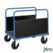 The photograph captures a durable and sturdy slingsby platform truck, made of galvanised steel and featuring a double-sided design. Its Konga deck provides a smooth surface for transportation, while the steel frame ensures stability and strength. Perfect for heavy-duty use in various industries.