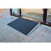 The photo shows two aluminium threshold wedge access ramps, one placed on top of the other. They are designed specifically for use in Slingsby parking facilities, providing easy access for vehicles of all sizes. The ramps have a durable and sturdy construction, with a smooth surface for safe travel.