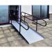 The image shows a permanent fixed ramp with telescopic legs and handrails at Slingsby Parking Facilities. The ramp is sturdy and secure, providing easy access for vehicles. The telescopic legs allow for adjustable height and the handrails offer added safety.