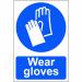 The image shows a collection of Spectrum Industrial PPE signs, specifically the Wear gloves sign made from 1.2mm recyclable PP material. The signs dimensions are 200 x 300mm, and the product code is 0003. The sign is brightly colored with bold text and graphics, clearly indicating the need for individuals to wear gloves in the designated area. The material is durable and eco-friendly, making it a suitable choice for any industrial setting.