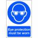 This image shows a sign from Spectrum Industrial for personal protective equipment (PPE) that reminds workers to wear eye protection. It is made of 1.2mm thick recyclable polypropylene and measures 200 x 300mm. The background is white with bold black text and an image of an eye wearing protective glasses. The sign is rectangular in shape and has rounded corners.