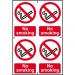 The photograph features two No Smoking signs from Spectrum Industrial made of 1.2mm recyclable PP material. The signs measure 200 x 300mm and feature bold text in white and red on a black background. The signs serve as a clear reminder to refrain from smoking in the area.