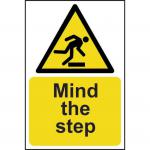 This photo captures a self-adhesive vinyl sign from Spectrum Industrial with bold lettering that reads Mind The Step. It features a vibrant yellow background with the dimensions of 200mm x 300mm. The warning sign is designed to alert individuals to uneven surfaces and potential hazards.