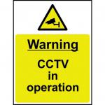 The photograph shows a yellow and black sign that reads Warning CCTV in Operation with a symbol of a camera in the center. The sign is made from 1.2mm recyclable PP and measures 300 x 400mm. It is designed for industrial use and is suitable for outdoor environments.