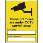 The photo shows a Spectrum Industrial CCTV sign, made of self-adhesive vinyl and measuring 300mm x 400mm. The sign reads These Premises Are Under CCTV Surveillance and features a camera symbol. The black and white design is clear and easy to read.