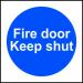 This fire safety sign is square and measures 100mm by 100mm. It is made of self-adhesive vinyl and features the words Fire Door Keep Shut in bold black lettering against a bright yellow background. The words are surrounded by a red border and there is an image of flames in the center. The sign is from Spectrum Industrial and is designed for industrial use.