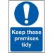The photograph shows a Spectrum Industrial Waste Disposal sign. The sign is rectangular, with dimensions of approximately 200mm x 300mm. It is made of self-adhesive vinyl and features bold black text against a white background. The text reads Keep These Premises Tidy and is accompanied by a graphic of a trash bin. The sign serves as a reminder to maintain cleanliness in the area marked.