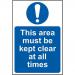 This picture shows a Spectrum Industrial Safety Sign with dimensions of 400 x 600mm. The sign is made of 1.2mm recyclable PP and features the message This area must be kept clear at all times. The background is white and the text is bold and black, making it easily visible. The sign is square in shape and has rounded corners. In the center of the sign, there is a bold red circle with a slash through it, indicating that the designated area must be kept clear. The sign is durable and suitable for industrial settings.