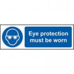 The picture shows a bright yellow sign with bold black lettering that reads Eye protection must be worn. The material is clearly marked as 1.2mm recyclable PP and the dimensions are 300 x 100mm. The sign is from Spectrum Industrial and is designed for use in industrial settings to promote workplace safety and the use of PPE.