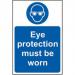 The photo shows a Spectrum Industrial PPE Sign for eye protection. The sign is made of self-adhesive vinyl and measures 200mm x 300mm. The sign features bold text and a graphic depicting a pair of safety glasses. It is designed to remind workers to wear proper eye protection on the job.