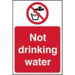 In the photograph, a small red and white sign can be seen against a plain background. The sign reads Prohibited Signs Not Drinking Water in bold, black font. The sign is made of vinyl and measures 200mm x 300mm. The bold colors and clear text make the sign eye-catching and easy to read.
