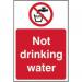 In the photograph, a small red and white sign can be seen against a plain background. The sign reads Prohibited Signs Not Drinking Water in bold, black font. The sign is made of vinyl and measures 200mm x 300mm. The bold colors and clear text make the sign eye-catching and easy to read.