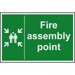 The photograph features a bright and bold fire safety sign from Spectrum Industrial. Made from 1.2mm recyclable PP, the sign displays a clear image of a fire assembly point, measuring 200 x 300mm. Its design is eye-catching and sure to catch the attention of those passing by.