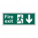 The photograph captures the bold red and white design of the Spectrum Industrial Fire Safety Signs Fire Exit (Man Arrow Down) Sign. The self-adhesive vinyl material ensures easy installation while the size of 400mm x 150mm makes it visible from a distance. Pack of 5 for added convenience.