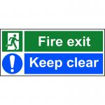 The Spectrum Industrial Fire Safety Signs Fire Exit Keep Clear Sign is a rectangular self-adhesive vinyl sign measuring 450mm x 200mm. It features bold white text on a red background with a prominent white arrow pointing to the right. The sign is designed to clearly mark fire exits and remind individuals to keep the area clear at all times.