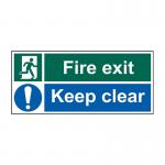This photograph of Spectrum Industrial Fire Safety Signs Fire Exit Keep Clear Sign captures a bright red exit sign with clear white lettering and a bold arrow pointing towards the exit. The self-adhesive vinyl material measures 450mm x 200mm and comes in a pack of 5 for easy installation in your industrial or commercial space.