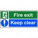 This photo shows a bright red and white fire exit sign from Spectrum Industrial. The sign features the words Fire Exit Keep Clear in bold, capital letters. It is made of self-adhesive vinyl and measures 600mm x 200mm. The background is a clean, white color with straight edges and clear, easy-to-read font. The sign is clearly visible and easy to understand, making it an effective safety measure for any industrial setting.