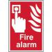 The photograph shows a bright red and white Spectrum Industrial Fire Safety Signs Fire Alarm Sign. It is made of self-adhesive vinyl and measures 200mm by 300mm.
